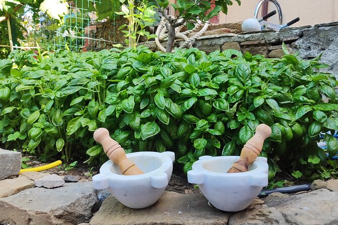 BarCa Winery Cinqueterre Trekking & Wine Tasting & Pesto Class - Making pesto with basil, mortar, and pestle