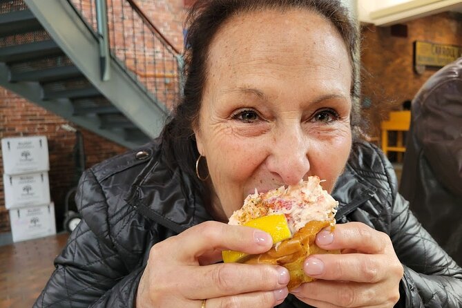 Boston Seafood & Freedom Trail Walking Tour - Quincy Market and Faneuil Hall, two different Boston experiences