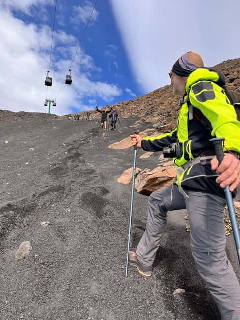 Catania: Mount Etna Adventurous Hiking Tour with Equipment - A descent through Grotta Pitagora and volcanic ash