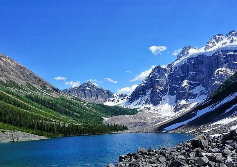 From Banff: Louise & Moraine Lake Guided Hiking Day Trip - From Moraine Lake into the forest