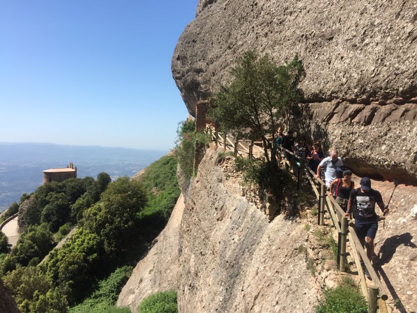 From Barcelona: Montserrat Mountain Hike and Abbey Tour - What the guide adds to the day