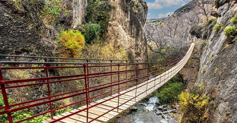 Granada: Guided Day Hike in Los Cahorros de Monachil - Crossing the hanging bridges above the gorge