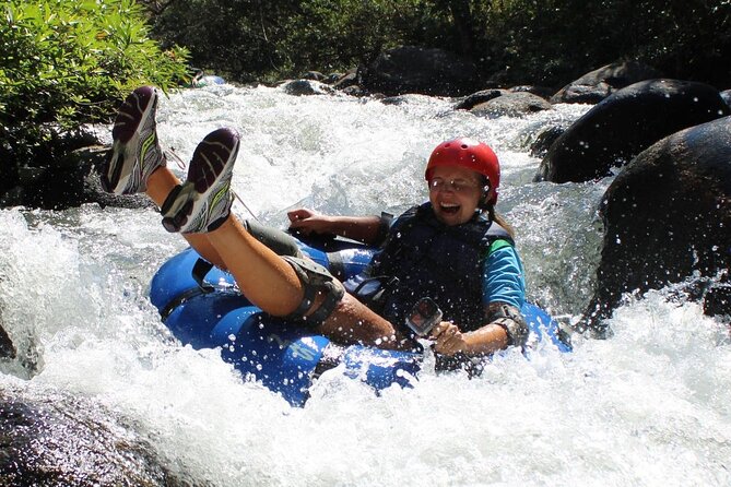 La Leona Waterfall Hike and River Tubing - River tubing through the Rincon de la Vieja region