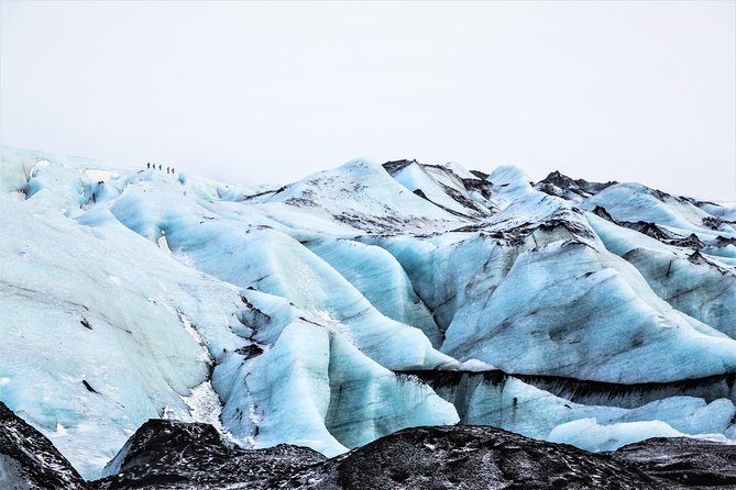 Reykjavik: South Coast, Waterfalls & Glacier Hike Small-Group - Skógafoss: spray, scale, and a climb for the view