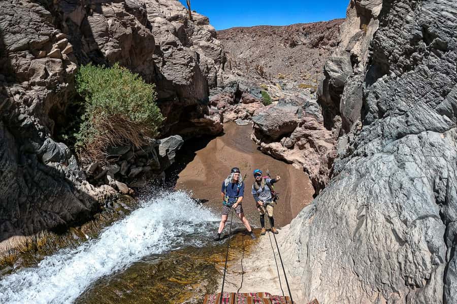 San Pedro de Atacama: Desert Tour with Canyoning & Trekking - Waterfalls, canyon walls, and a desert swimming break