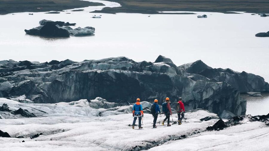 Sólheimajökull: Glacier Hike and Blue Ice Cave Tour - Getting fitted for crampons and safety gear